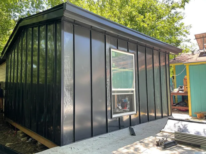 Black standing seam metal wall panels for Roof Inspection in Hollis